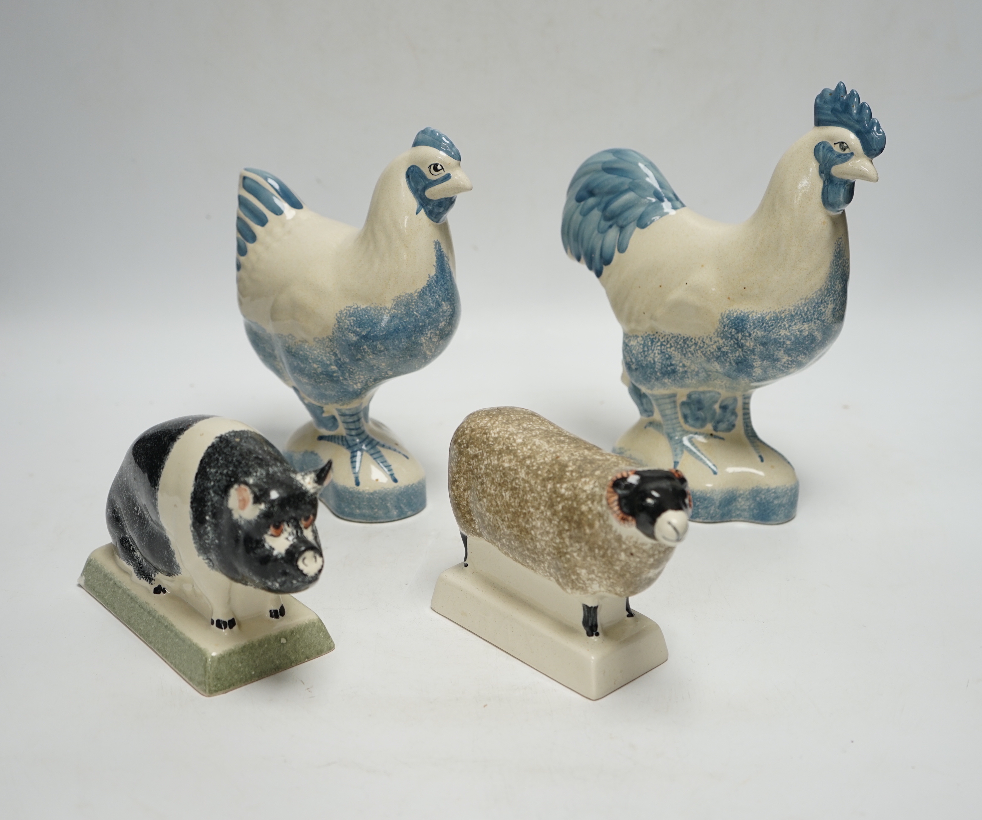 Four pieces of Rye Pottery to include a sow, ram, chicken and cockerel, 22cm